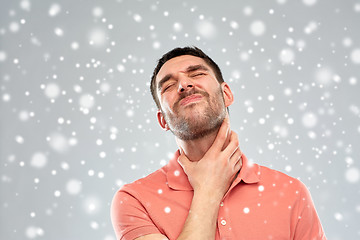 Image showing man touching neck and suffering from throat pain