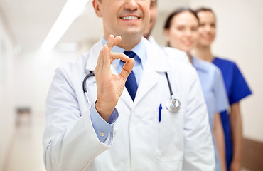 Image showing close up of doctors at hospital showing ok sign