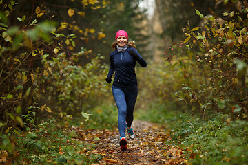 Image showing Portrait in full growth of running young women in forest