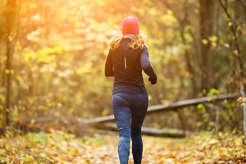 Image showing Beautiful sportswoman running in morning