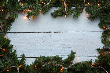 Image showing Spruce branches on wooden background