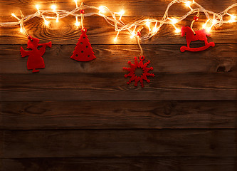 Image showing Red felt toys with garland