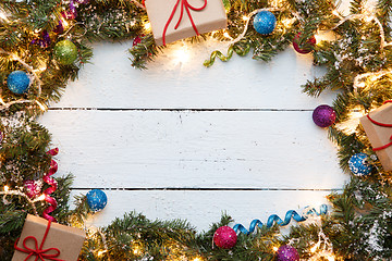 Image showing Christmas spruce branches with gifts