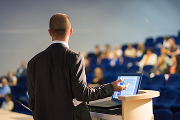 Image showing Public speaker giving talk at business event.