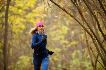 Image showing Beautiful woman running in morning