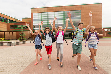 Image showing group of happy elementary school students running