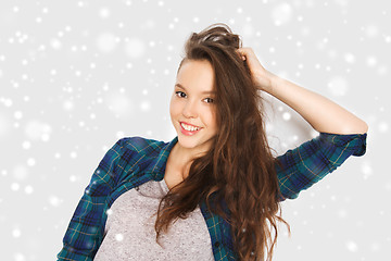 Image showing happy smiling pretty teenage girl over snow