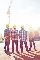 Image showing group of builders in hardhats outdoors