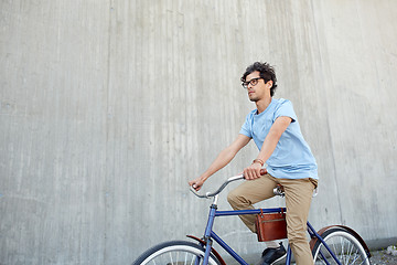 Image showing young hipster man riding fixed gear bike