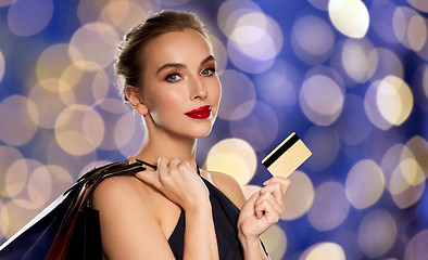 Image showing woman with credit card and shopping bags