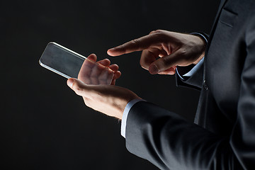 Image showing close up of businessman with glass smartphone