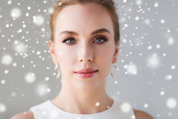 Image showing close up of beautiful woman or bride over snow