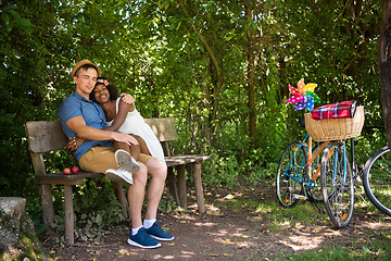 Image showing Young  couple having joyful bike ride in nature