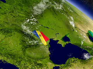 Image showing Moldova with embedded flag on Earth