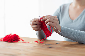 Image showing woman hands knitting with needles and yarn