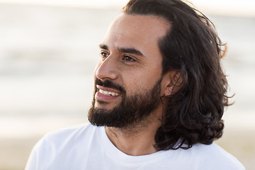 Image showing happy smiling man with beard outdoors