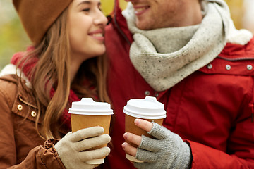Image showing close up of happy couple with coffee in autumn