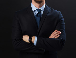 Image showing businessman in suit and smartwatch