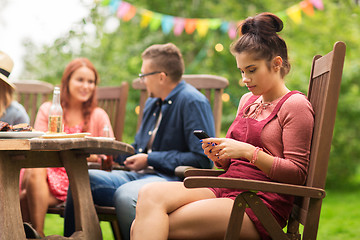 Image showing woman with smartphone and friends at summer party