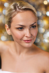 Image showing close up of young woman sitting in bath towel