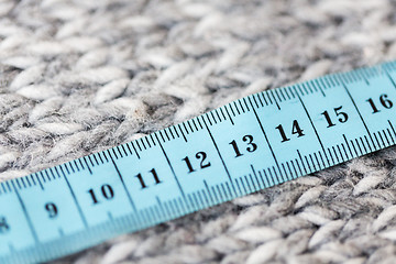 Image showing close up of knitted item with measuring tape