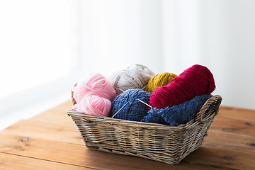 Image showing basket with knitting needles and balls of yarn