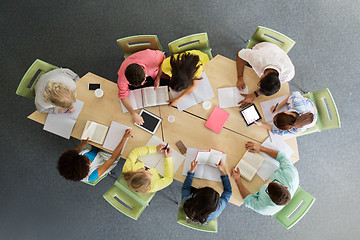 Image showing group of students with tablet pc at school library