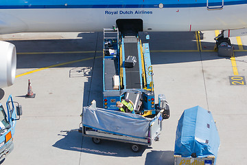 Image showing AMSTERDAM, NETHERLANDS - AUGUST 17, 2016: Loading luggage in air