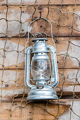 Image showing Old kerosene lamp hanging