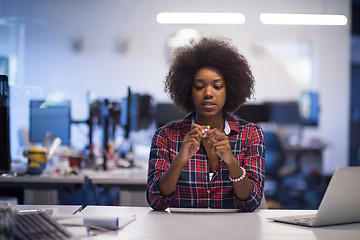 Image showing young black woman at her workplace in modern office  African-Ame