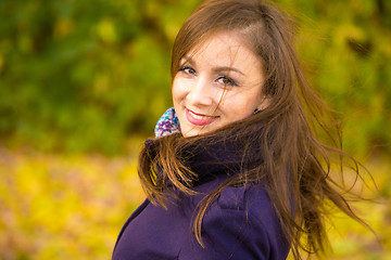 Image showing Portrait of a smiling beautiful girl with disheveled hair