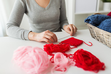 Image showing woman hands with knitting needles and yarn