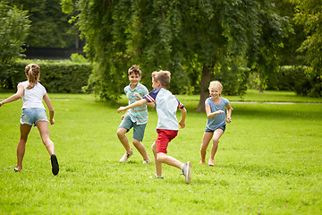 Image showing happy kids running and playing game outdoors