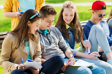 Image showing group of students with notebooks at school yard