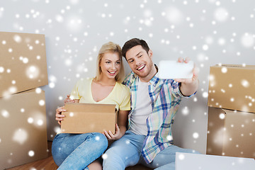 Image showing couple with taking smartphone selfie and moving