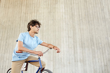 Image showing young hipster man riding fixed gear bike