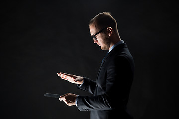 Image showing close up of businessman with transparent tablet pc
