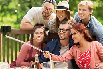 Image showing friends taking selfie at party in summer garden