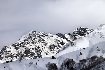 Image showing Snow sunlight mountain and cloudy sky at gray evening