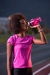 Image showing Portrait of a young african american woman running outdoors