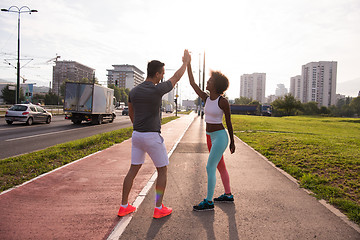 Image showing couple congratulating on morning run ginis