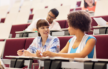 Image showing group of students talking in lecture hall