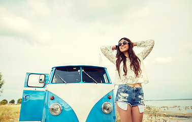 Image showing smiling young hippie woman in minivan car