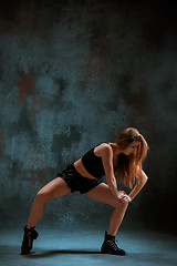 Image showing Attractive girl dancing twerk in the studio