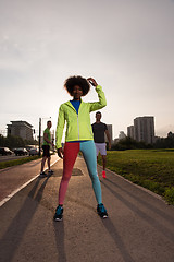 Image showing Portrait of sporty young african american woman running outdoors