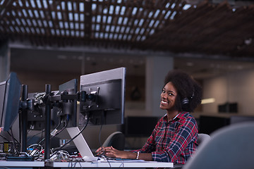 Image showing young black woman at her workplace in modern office  African-Ame