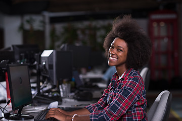 Image showing portrait of a young African American woman in modern office