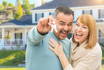Image showing Happy Mixed Race Couple in Front of House with New Keys