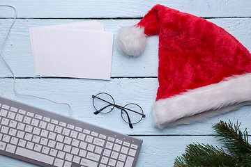 Image showing Santa hat, keyboard, spruce branch