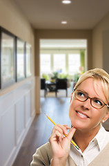 Image showing Woman with Pencil Inside Hallway of House